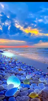 Vibrant sunset over a pebble-strewn beach with colorful clouds.