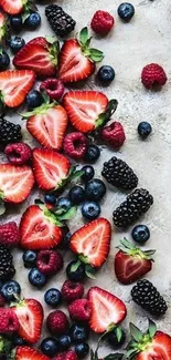 A colorful wallpaper showcasing strawberries, blueberries, and blackberries.