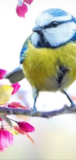 Bright bird perched on a branch with pink blossoms in a natural setting.