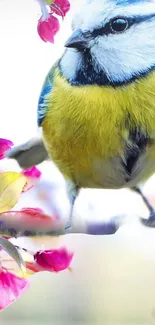 Vibrant yellow bird on a blooming branch with colorful petals.