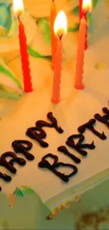 Vibrant birthday cake with colorful candles and happy birthday text.