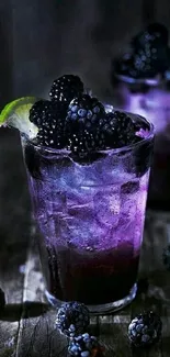 Purple blackberry cocktail with lime on rustic background.