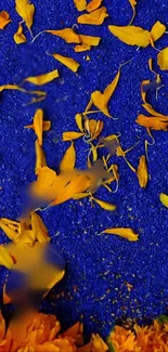 Vibrant wallpaper with blue background and scattered orange petals.