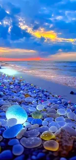 Vibrant blue beach sunset with colorful pebbles.