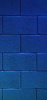 Vibrant blue brick wall with textured surface for mobile wallpaper.