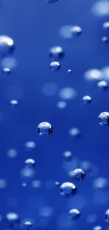 Vibrant blue mobile wallpaper with floating bubbles.