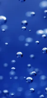 Mobile wallpaper with vibrant blue bubbles on a deep blue background.