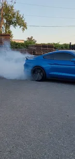 Blue sports car doing a burnout with smoke