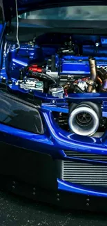 Close-up of vibrant blue car engine details.