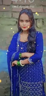 Woman in vibrant blue ethnic attire with a starry background.