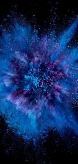 Vibrant blue explosion on dark background wallpaper.