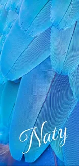 Vibrant blue feathers forming a textured pattern on a mobile wallpaper.