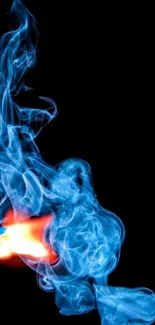 Blue flame and smoke on black background.