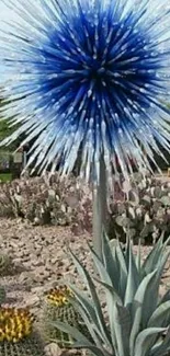 Vibrant blue glass sculpture in a cactus garden setting.