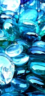 A collection of vibrant blue glass pebbles in various shades.