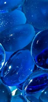 A vibrant blue glass sphere wallpaper for mobile.