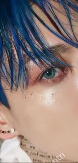 Close-up portrait with vibrant blue hair and eye focus.