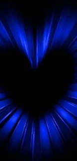 Blue heart glowing in a dark background.