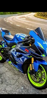 Vibrant blue sport motorcycle on a curvy road.