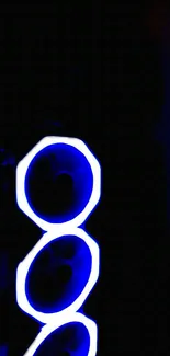 Blue neon circles on a dark background wallpaper.