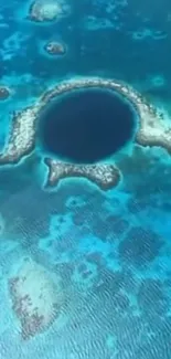 Aerial view of the Great Blue Hole with vibrant blue water.