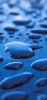 Close-up of blue water droplets on a smooth surface, creating a calming, abstract design.