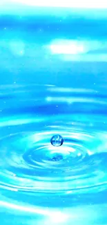 Blue water ripple with droplet on a calm surface.