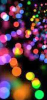 Colorful bokeh light pattern on black background.