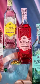 Bloom Gin bottles on a colorful fabric backdrop, blending pink and blue hues.