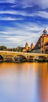 Vibrant blue sky over historic bridge and calm water reflection.