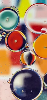 Vibrant abstract wallpaper with colorful bubbles on a multicolored backdrop.