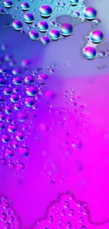 Vibrant wallpaper with purple and pink bubbles.