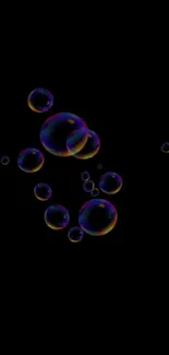 Vibrant black wallpaper with floating colorful bubbles.