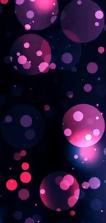 Vibrant pink and purple bubbles floating on a dark background wallpaper.