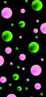 Colorful bubbles wallpaper with green and pink bubbles on black background.