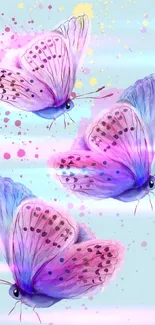 Three vibrant watercolor butterflies on a blue background.