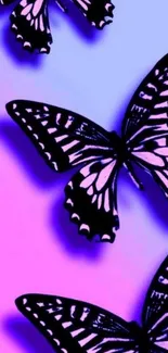 Colorful butterfly wallpaper with purple and black hues on a vibrant gradient background.