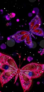 Vibrant pink and purple butterflies wallpaper on black background.