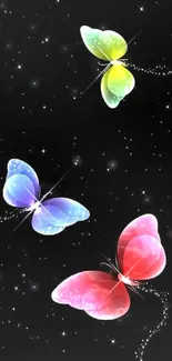 Three colorful butterflies on a starry black background.