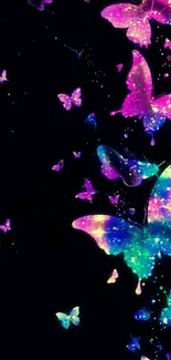 Colorful neon butterflies on a black background forming a galaxy-like pattern.