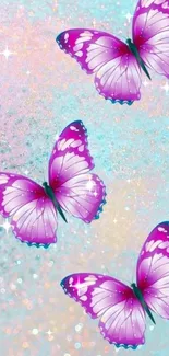 Three vibrant butterflies on a turquoise sparkling background.