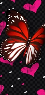 Red butterfly on black heart-patterned background wallpaper.