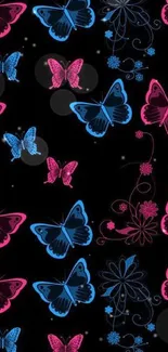 Black wallpaper with neon blue and pink butterflies.