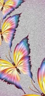 Vibrant colored butterflies on a silver background.