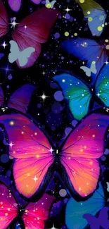 Neon butterfly wallpaper with dark background and vibrant colors.