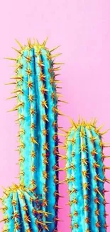 Bright blue-green cacti on a pink backdrop phone wallpaper.