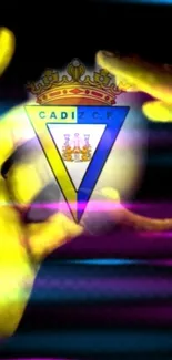 Cadiz CF emblem on vibrant yellow background with colorful effects.