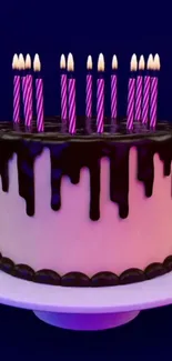 Cake with chocolate drips and purple candles on a blue background.