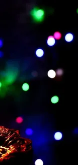 Candlelight and colorful bokeh wallpaper for mobile.