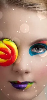 Colorful face art with lollipop eye makeup.